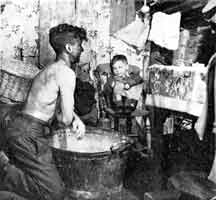 A miner bathing after work in 1915